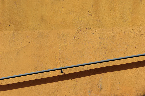 Handrail and the Orange Wall